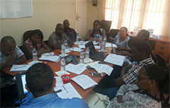 group of people at a table collaborating and discussing