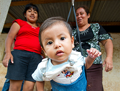 a baby gets weighed in Guatemala