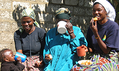 three women and a baby eating